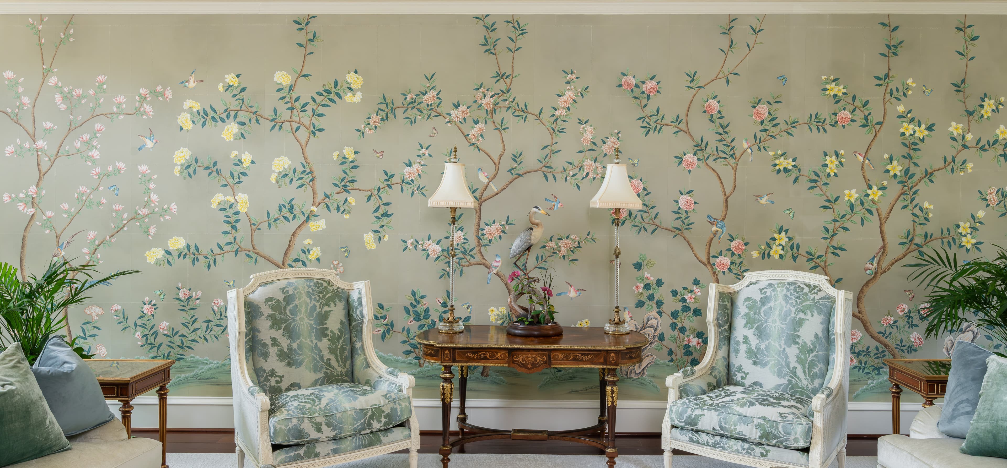 Gracie Studio Chinoiserie mural installation — hand-painted floral scenic in a living room